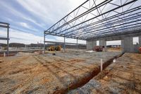 an under construction view of an industrial building on a construction site in the middle of winter