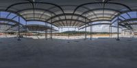 the inside of a building under construction with a big ceiling and many columns inside of the structure