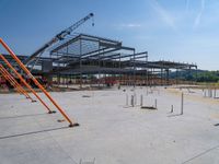 a building being built with concrete and steel frameworks on the outside ground on a sunny day