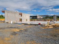 the construction site has been built with materials for some concrete and wood work, like some other building material, and lots of steel