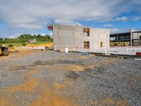 the construction site has been built with materials for some concrete and wood work, like some other building material, and lots of steel