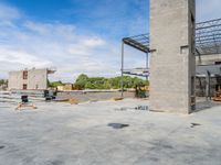 a concrete structure under construction with a lot of bricks and steel bars on each side