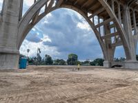 a construction site under a bridge that has been under construction for the first time of the day