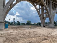 a construction site under a bridge that has been under construction for the first time of the day