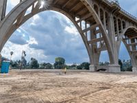 a construction site under a bridge that has been under construction for the first time of the day