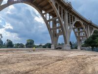 a construction site under a bridge that has been under construction for the first time of the day