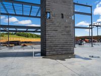 an unfinished building under construction with metal frameworks and a concrete fireplace and other building equipment