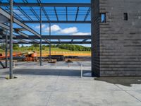 an unfinished building under construction with metal frameworks and a concrete fireplace and other building equipment