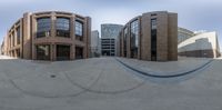 a large building that has a skateboard ramp on top of it is an example of a contemporary architecture