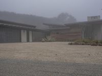 this is a nice contemporary ranch house on foggy day in the neighborhood of an unknown state