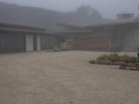 this is a nice contemporary ranch house on foggy day in the neighborhood of an unknown state