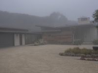 this is a nice contemporary ranch house on foggy day in the neighborhood of an unknown state