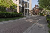 an apartment with a street sign that says the house is on the corner of a brick street