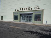 a corner store building that reads jc penneyco on the side of it's wall