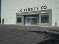 a corner store building that reads jc penneyco on the side of it's wall