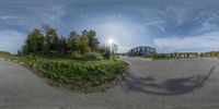 360 - view of road and building in countryside area with trees on both sides of it