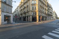 a cross walk on a street corner with buildings and buildings around it in paris, france