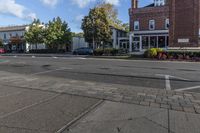 a cross walk on the street in an english village with no cars crossing the road