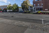 a cross walk on the street in an english village with no cars crossing the road