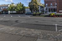 a cross walk on the street in an english village with no cars crossing the road