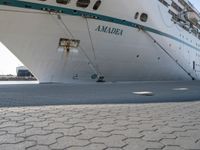 this is an image of a large cruise ship docked by the water's edge