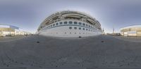 a close up view of a cruise ship parked next to another boat in a marina