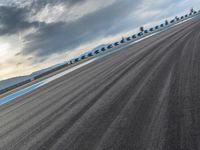 Curve Racing Road: A View of Clouds and Daylight