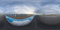 a view from a fisheye lens of the racetrack with lots of blue fabric on it