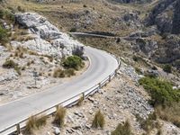 the paved curved highway going up to the mountains in israel, has two sides divided