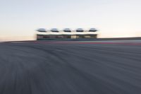 Curved Race Track at Dawn: Racing Under the Clouds