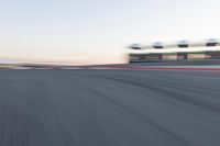 Curved Race Track at Dawn: Racing Under the Clouds