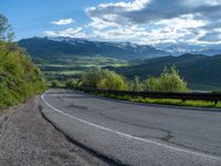 Curved Road in Colorado: Surrounded by Mountain Landscape