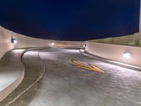 a view of a road and an overpass with traffic passing through it by buildings