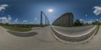 a 360 - view photo of a curved road in an amusement park area at the same time