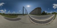 a 360 - view photo of a curved road in an amusement park area at the same time