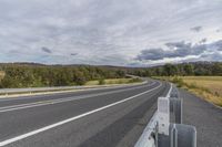 Curved Road with Trees and Clouds