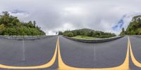 a series of 360 - degree photos with yellow markings of two curved roads passing each other