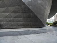 the building is shaped like a tunnel with a curved sidewall that wraps a very large area