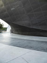 the building is shaped like a tunnel with a curved sidewall that wraps a very large area