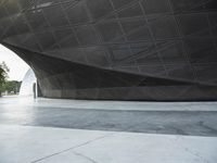 the building is shaped like a tunnel with a curved sidewall that wraps a very large area