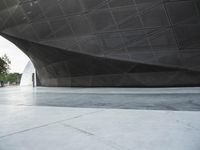 the building is shaped like a tunnel with a curved sidewall that wraps a very large area