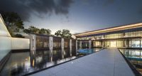 the building's water features a curved walkway and fountains as well as a long wall