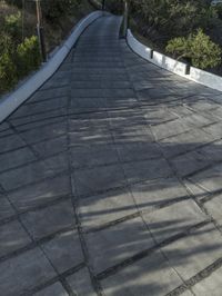 the exterior and landscape of a modern house in los angeles, california with stone and wood