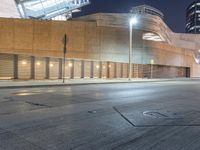 a empty, empty parking lot in front of a building in downtown san francisco at night