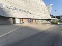 the entrance to the smithsonian and science campus with posters all over it's sides