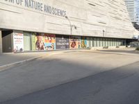 the entrance to the smithsonian and science campus with posters all over it's sides