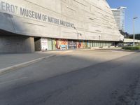 the entrance to the smithsonian and science campus with posters all over it's sides