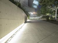 this is the image of a parking lot with a building in the background at night