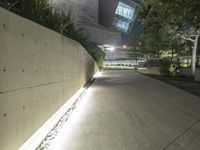 this is the image of a parking lot with a building in the background at night