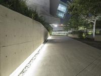 this is the image of a parking lot with a building in the background at night